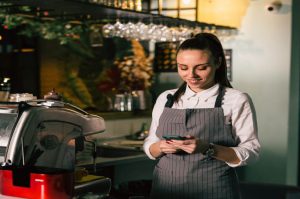 Restaurant-worker-on-cell-phone