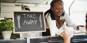 food-truck-staff-passing-food-to-customer